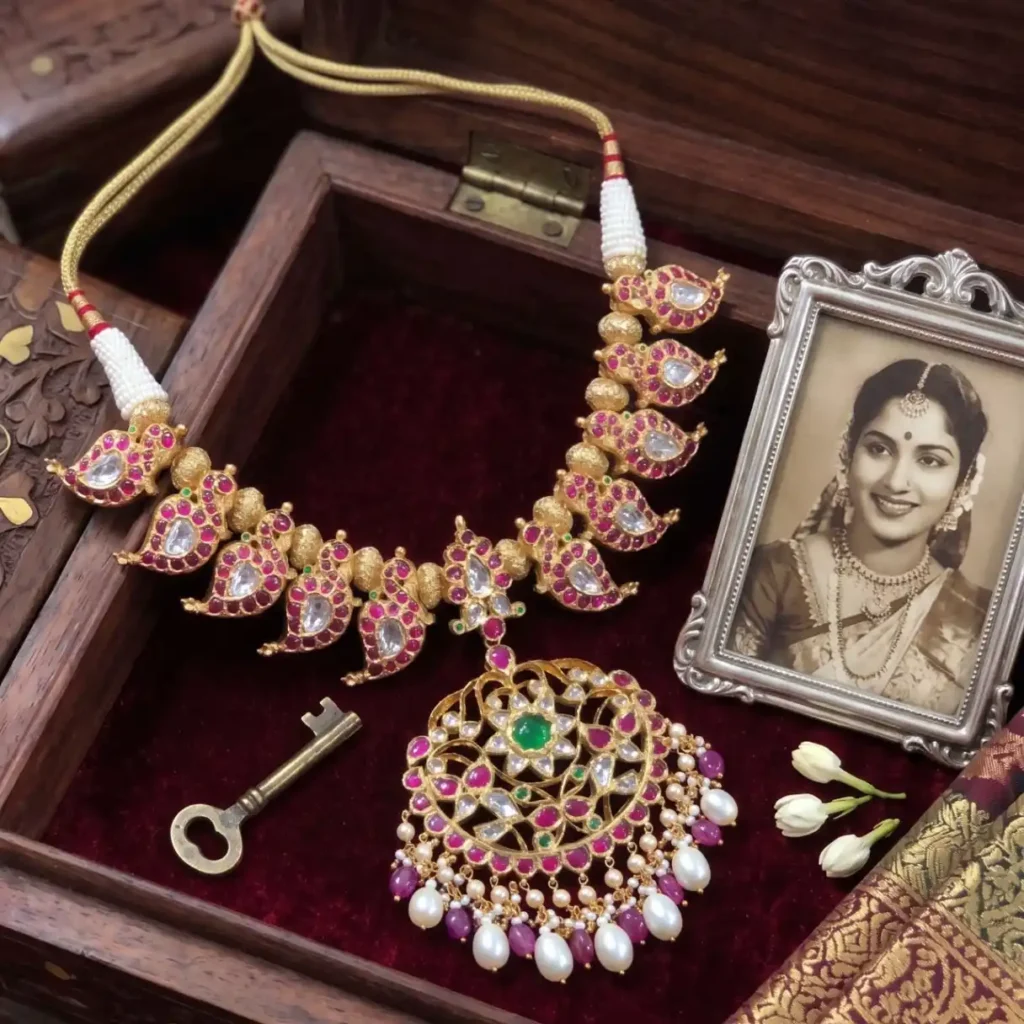 Traditional Mango Mala necklace with Polki stones and Jadau craftsmanship in heritage jewellery box Jaipur