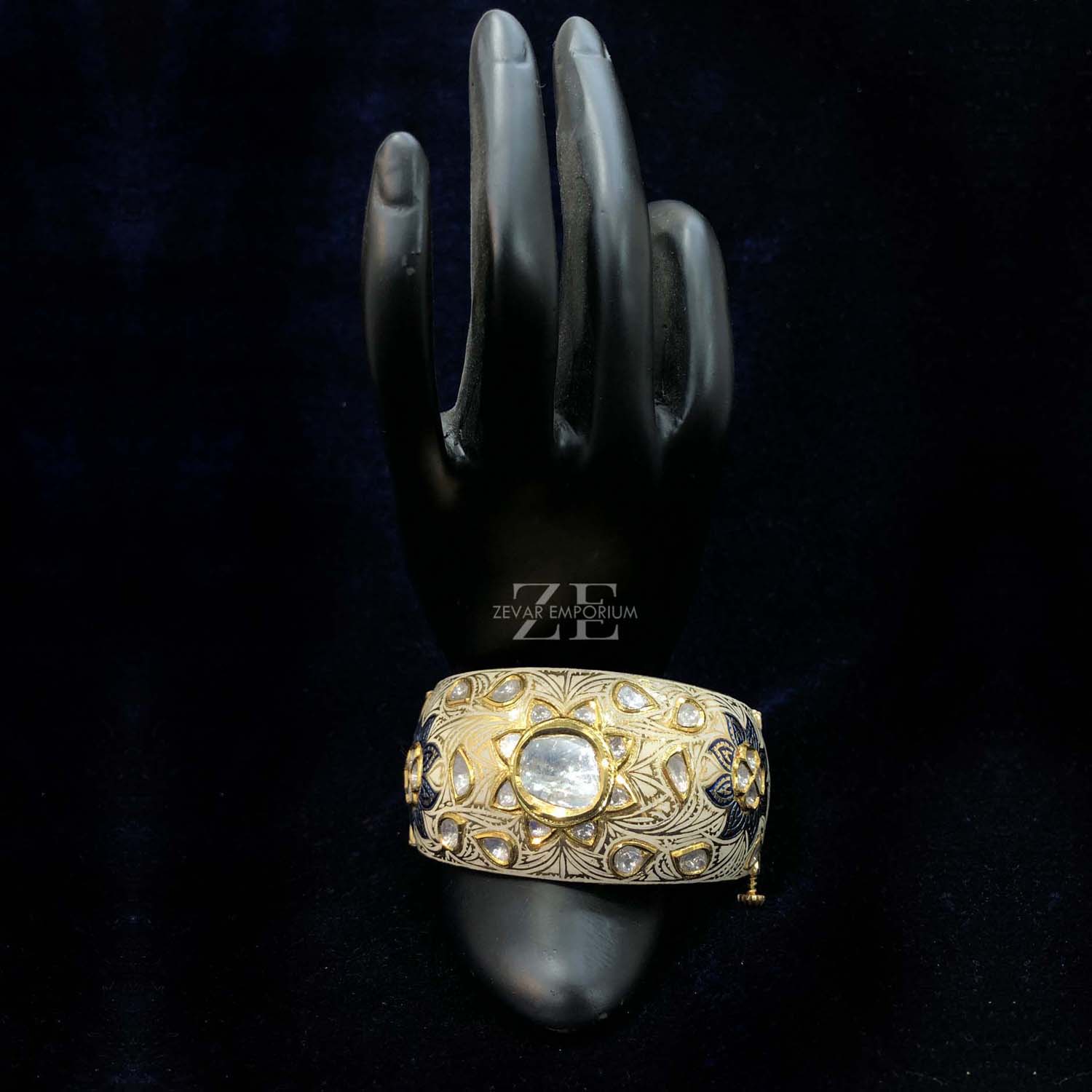 Close-up of Fine Ivory and Blue Meenakari Art on 18K Gold Polki Bangle