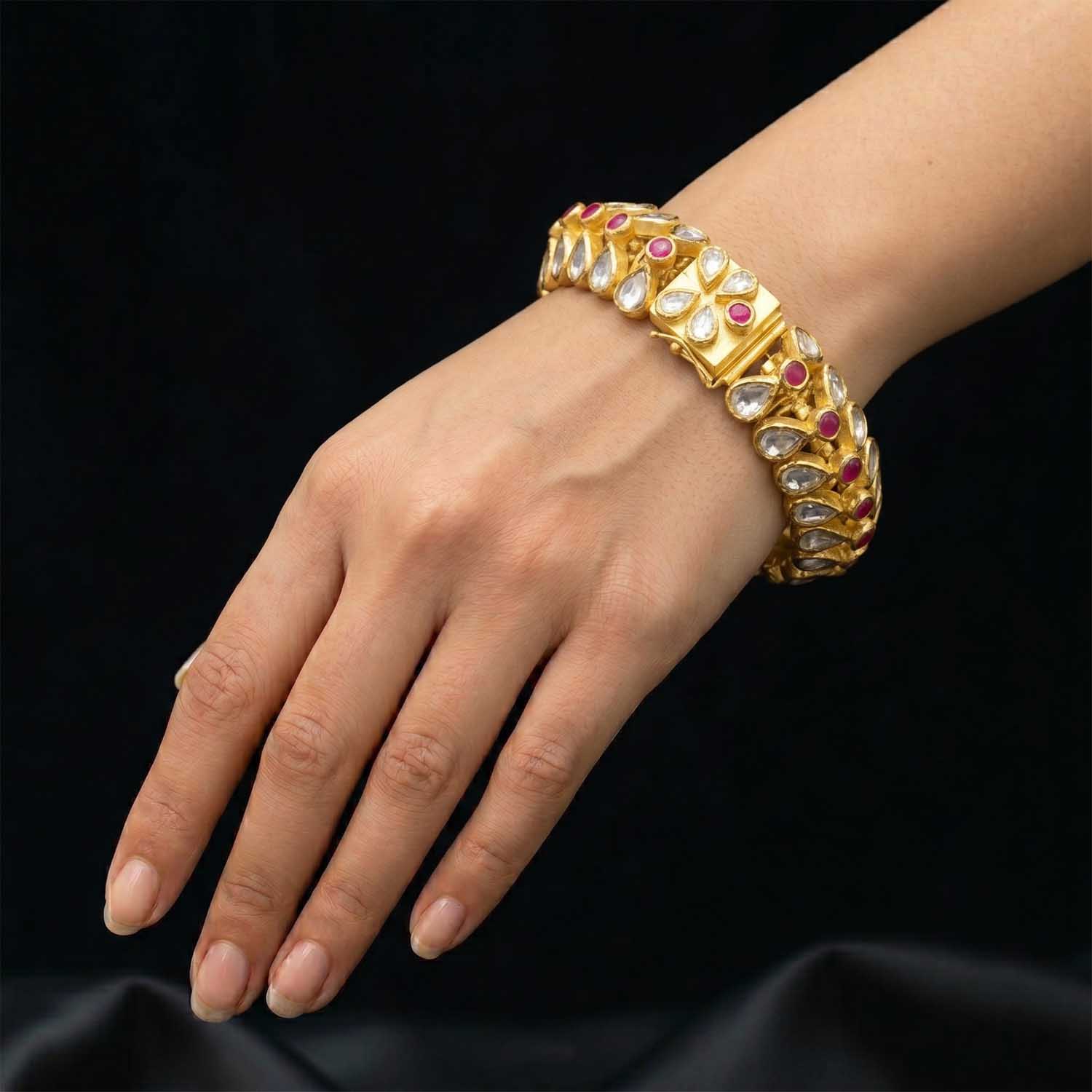 Model wearing 18k gold Rajasthani Polki bangle for bridal jewellery inspiration