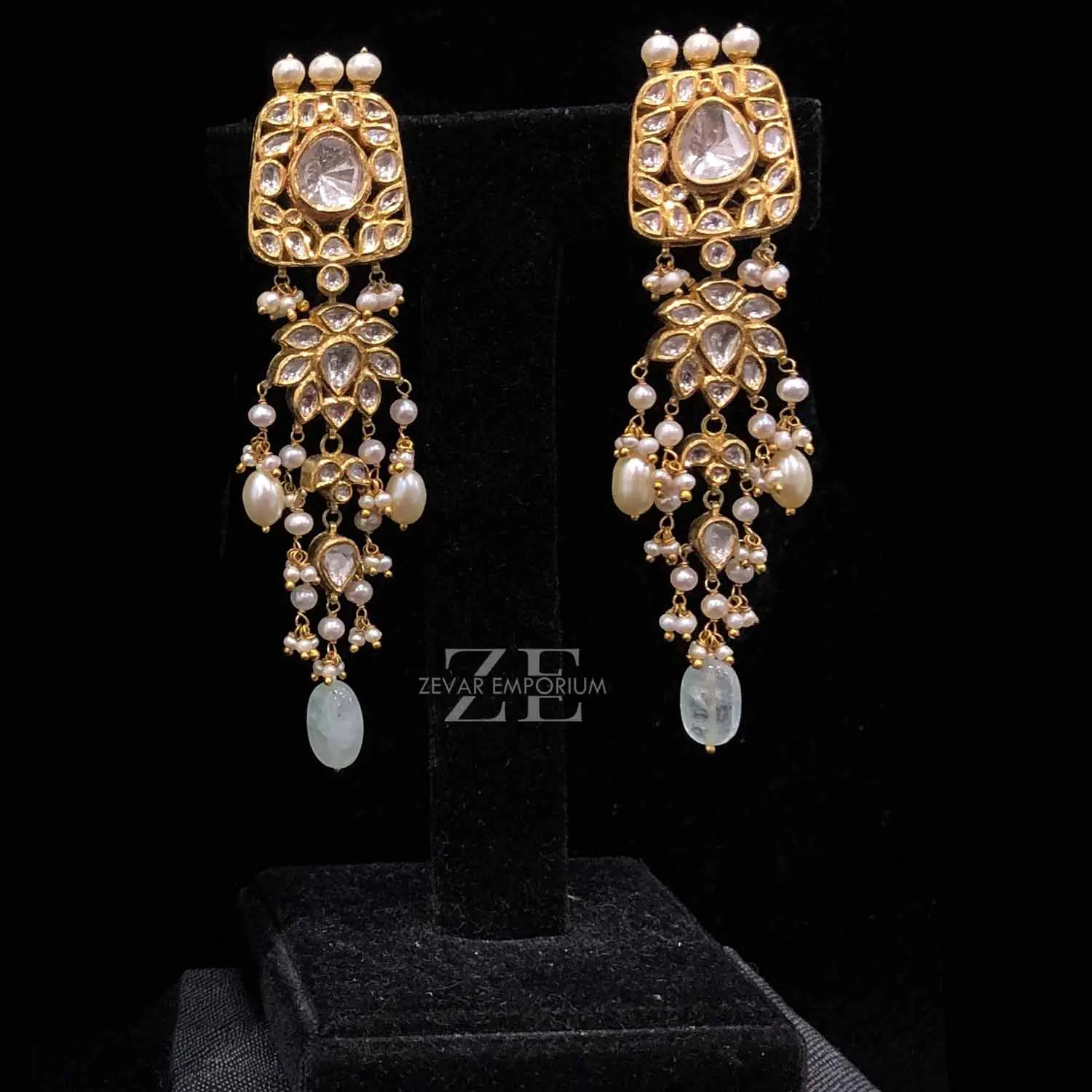 Elegant bridal Polki long drop earrings featuring a big Polki uncut diamond stud and delicate pearl fringes.