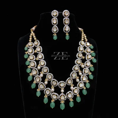 Polki Diamond 2 line Necklace in 14K Gold featuring a stunning fusion design with dual diamond strings and green gemstone drops.