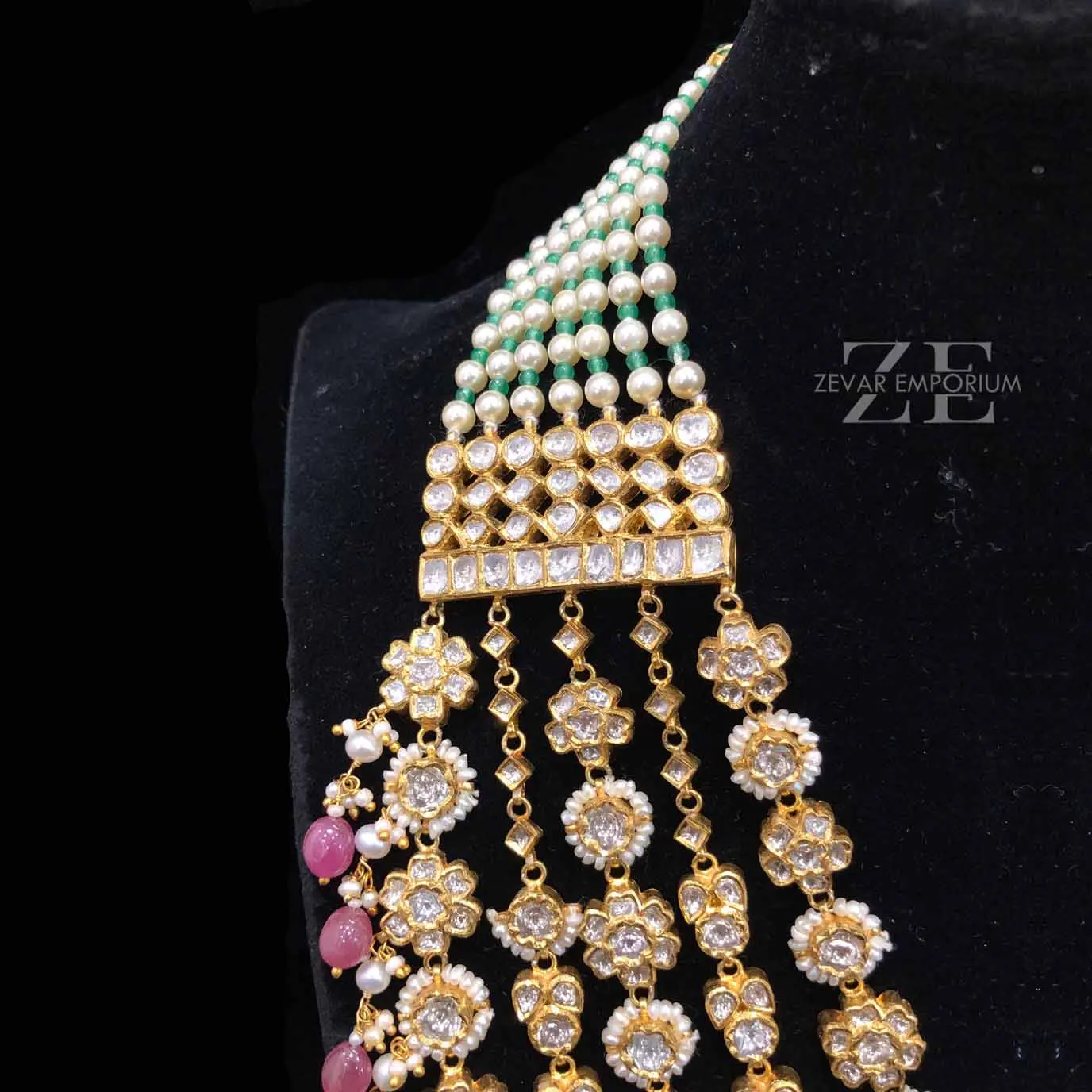 Intricate 5 string raani haar medallion links showcasing precise uncut diamond settings and tiny pearl edging.