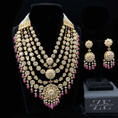 Polki Rani Haar Jadau Necklace crafted in 18K gold featuring a 5-layer design with syndicate uncut diamonds and pink ruby drops.