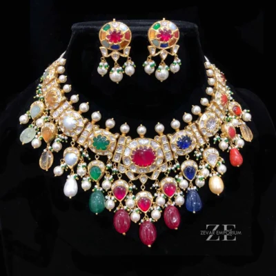 Navratana Polki Choker Gold Necklace in 18K Gold featuring a stunning traditional design with 9 precious gemstones and uncut diamond polki settings.