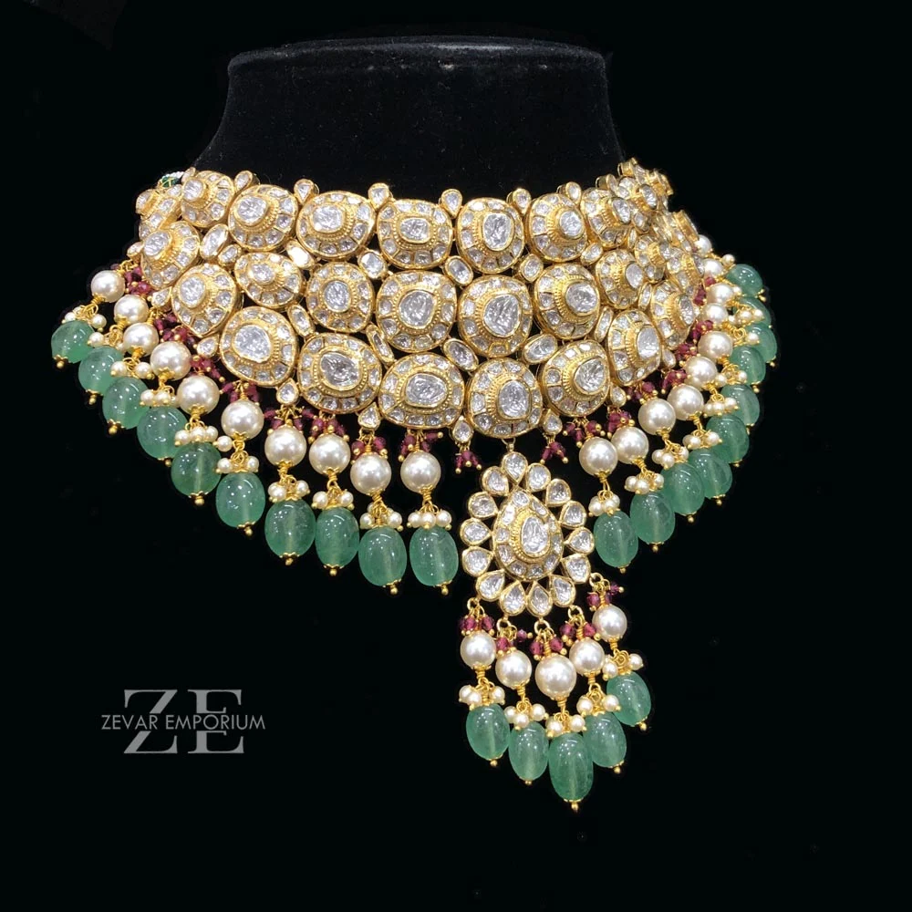 Side view of 18K gold Jadau Polki bridal choker with green beryl drops